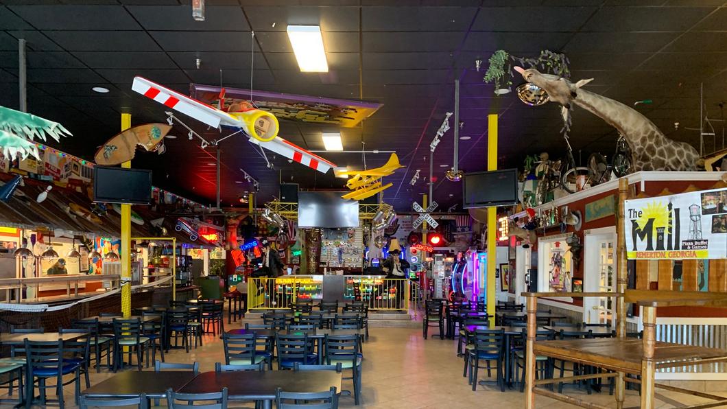 Full interior of The Mill with eclectic ceiling decor